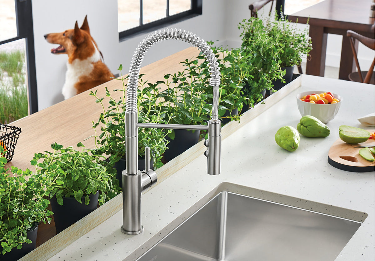 Blanco Catris Semi-Pro Faucet installed in a bright, modern kitchen—PVD Steel finish