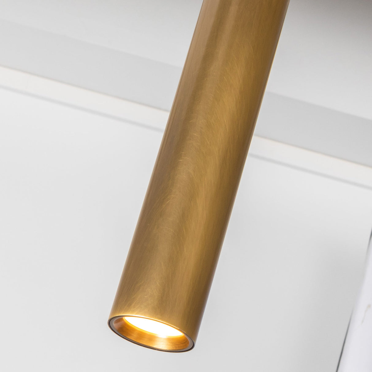 Kuzco Mason 4 Head Linear Pendant – Adjustable with Metal Strap Detail