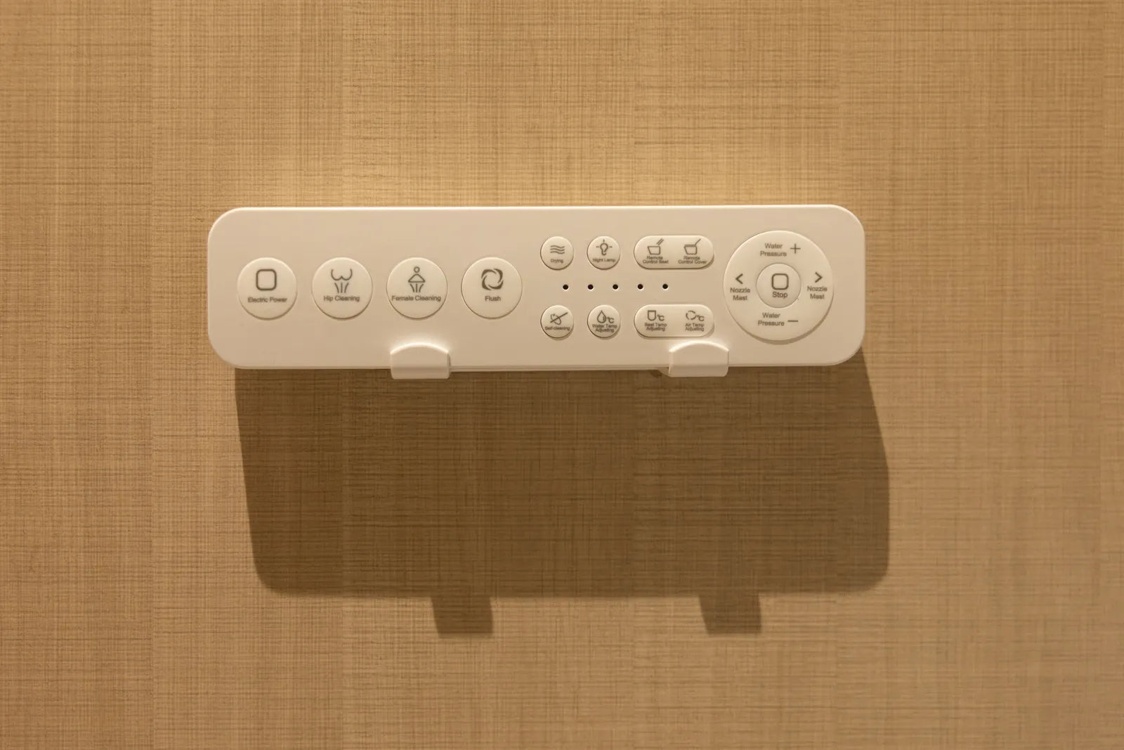 Smart bidet toilet seat with wall-mounted remote control panel