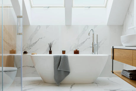 Sleek skirted two-piece toilet in a bright modern bathroom