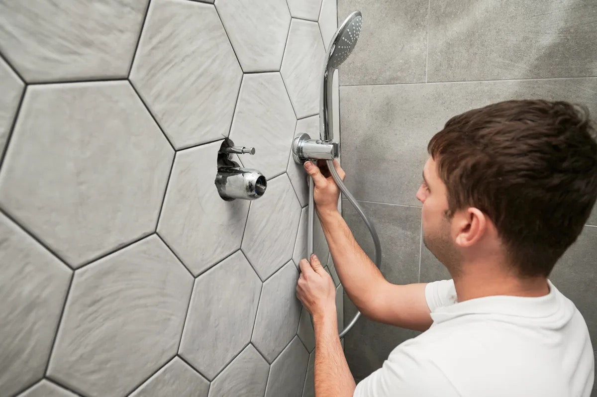 Shower head and controls in a bathroom