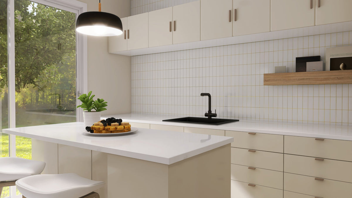 Row of pendant lights hung at even spacing over a kitchen island
