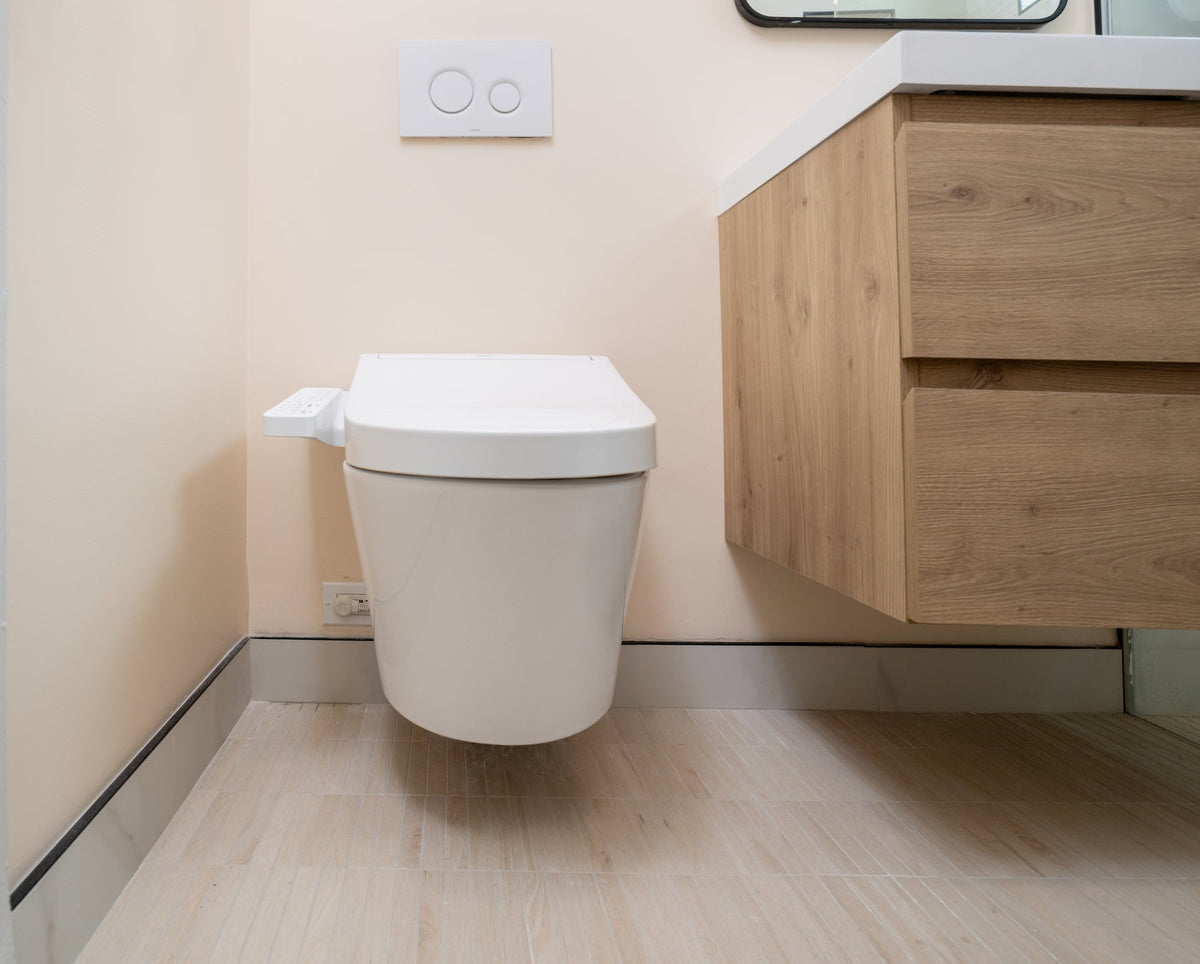 Low-profile smart toilet with integrated bidet seat in a modern bathroom