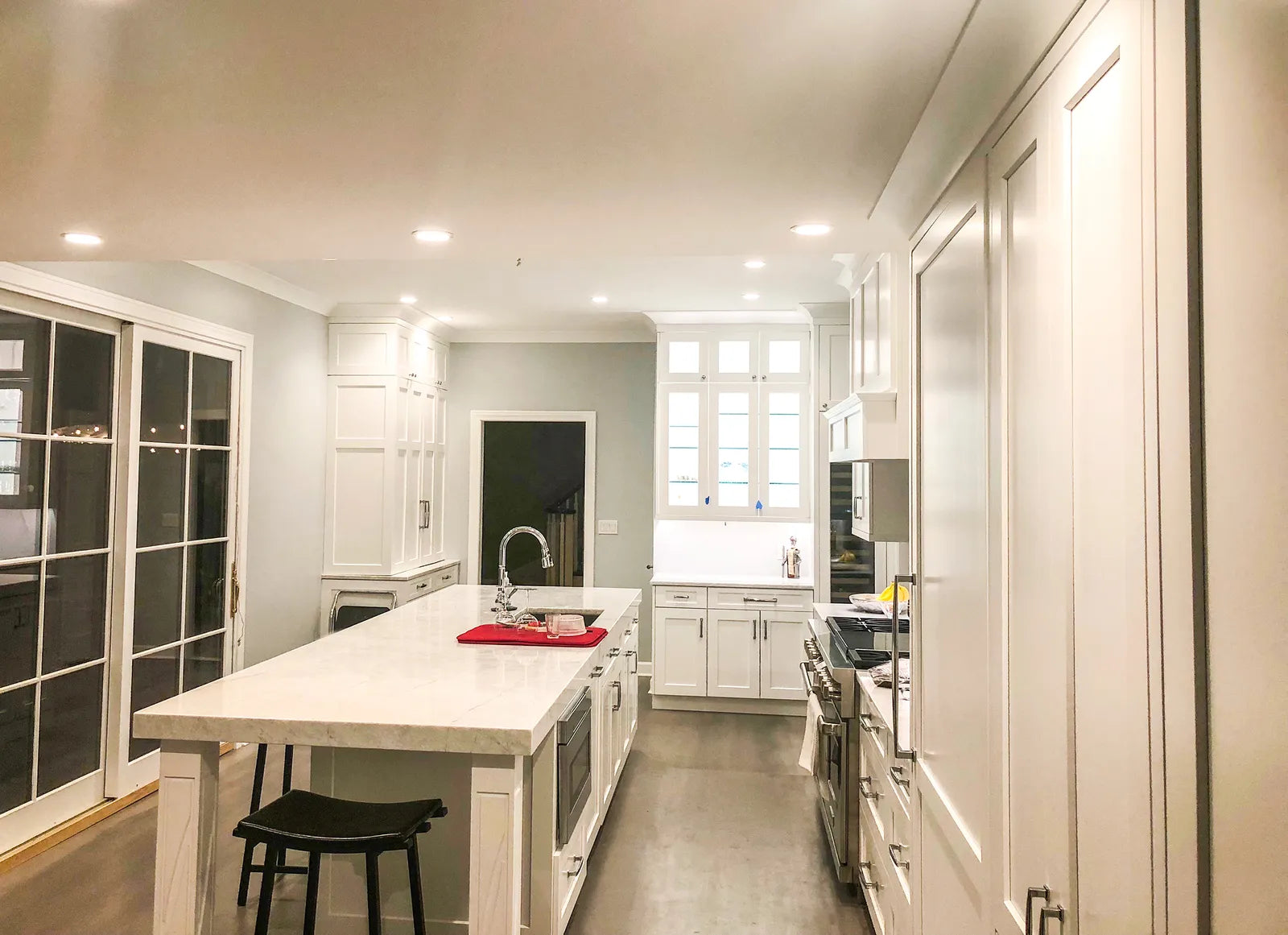 Stainless steel undermount kitchen sink set into a quartz countertop