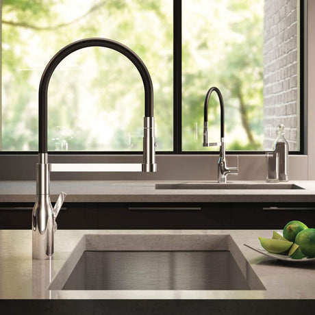 Semi-pro commercial style kitchen faucet with coiled spring spout over a deep stainless steel sink