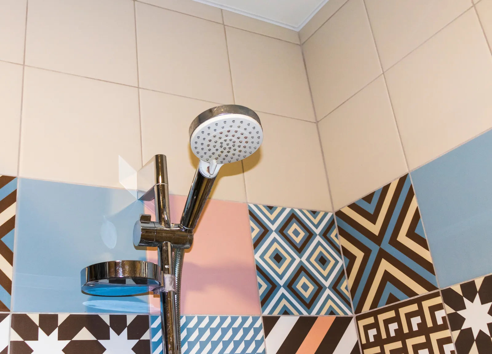 Modern walk-in shower with rain head, hand shower and wall-mounted thermostatic controls