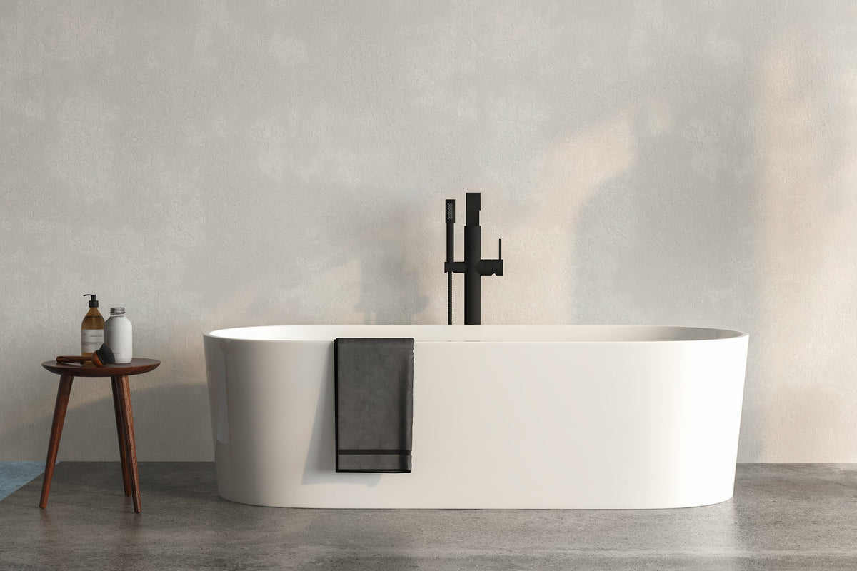 White freestanding bathtub in a bright modern bathroom, showing the floor space and clearance a full-size tub requires