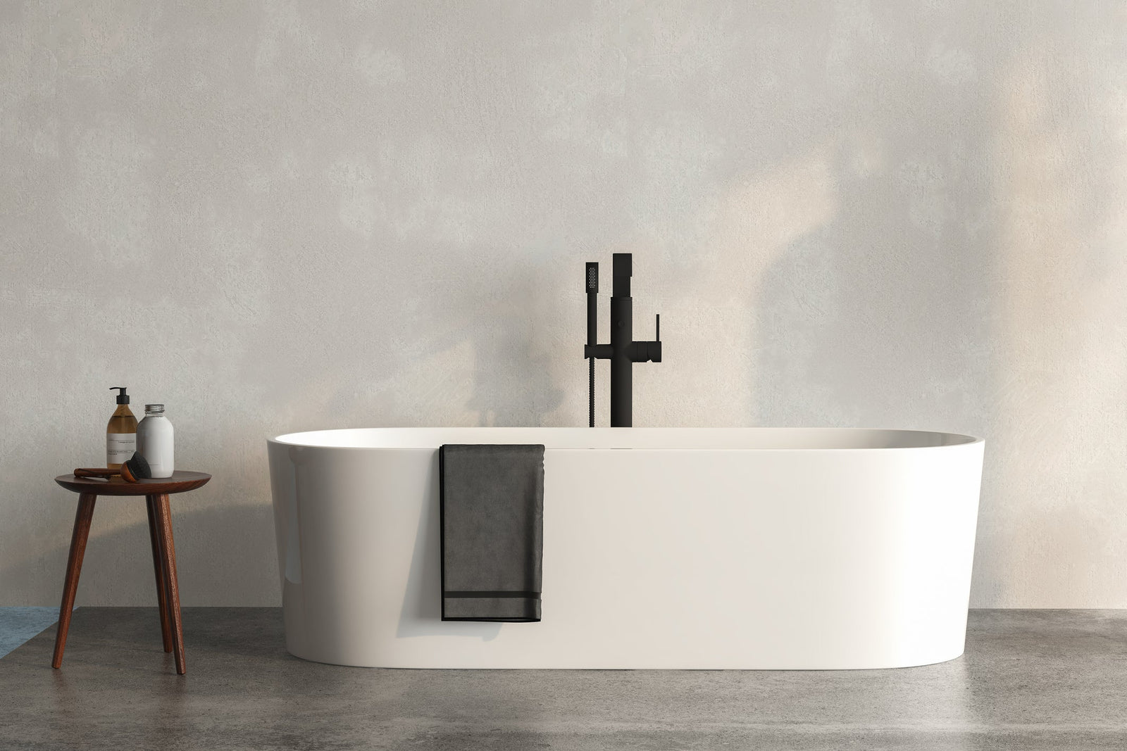 White freestanding bathtub in a bright modern bathroom with natural light