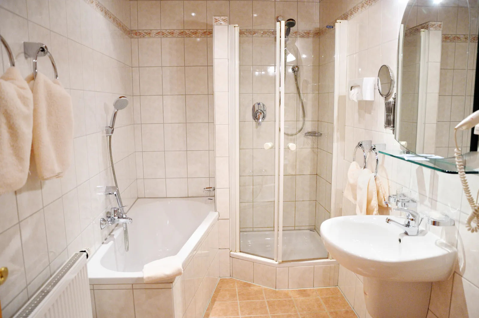 White seamless acrylic one-piece shower stall in a renovated bathroom