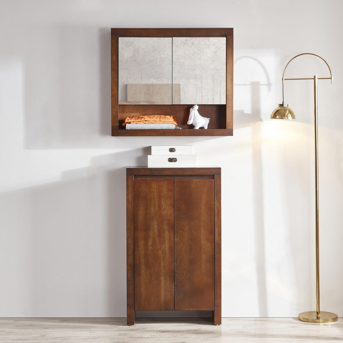 Backlit LED bathroom mirror mounted above a wood vanity in a modern Canadian bathroom