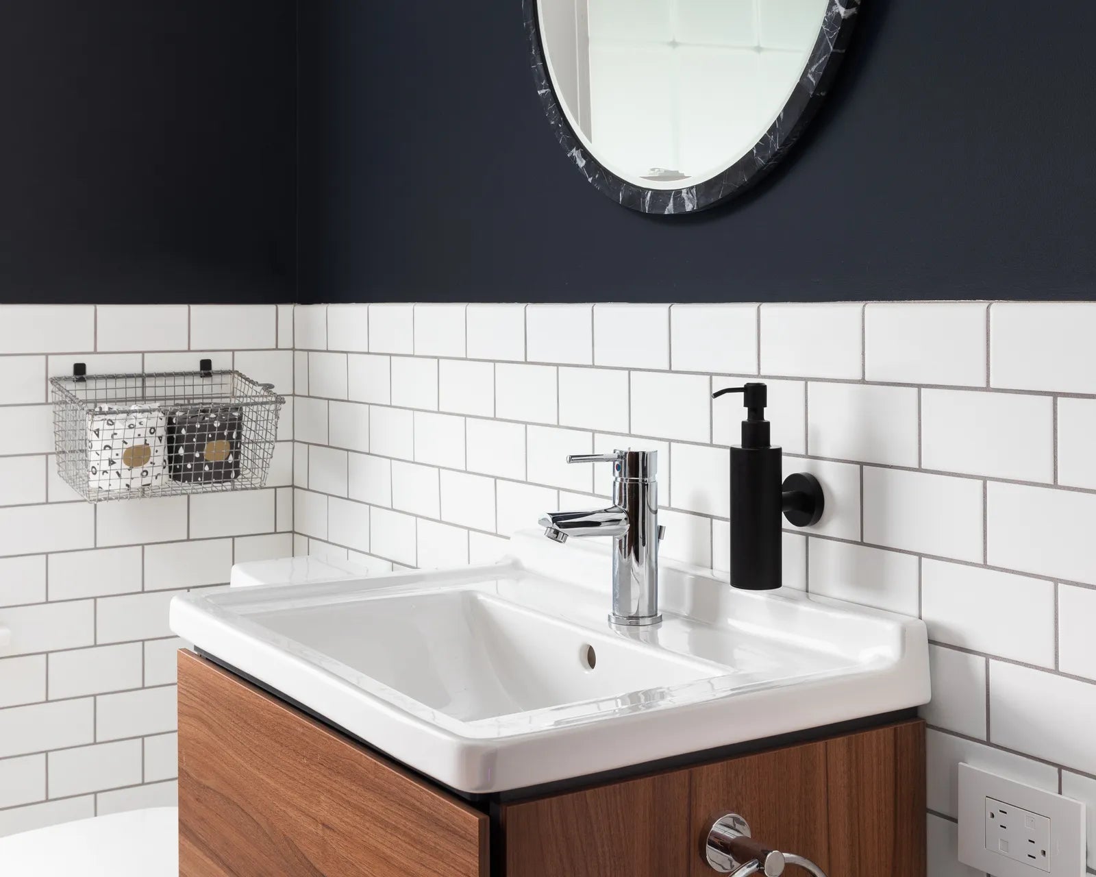 Modern wall-hung bathroom vanity floating above a tiled floor with open space underneath