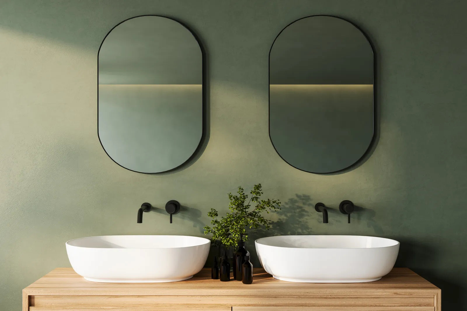 Modern double vanity with two sinks, twin mirrors and wall sconces in a bright bathroom