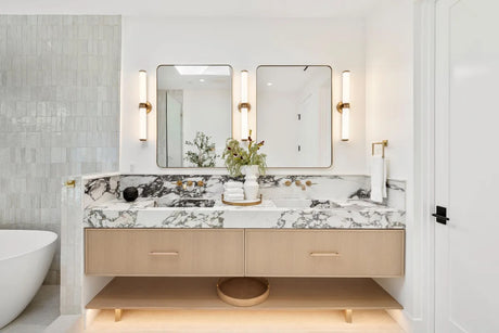 Modern bathroom vanity with a marble countertop and mirrors