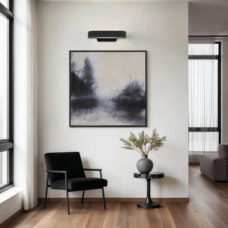 Renwil Saba picture light installed above framed artwork in a modern room