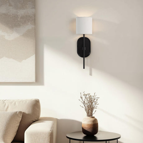 Renwil Fico wall sconce installed above a side table in a modern living room