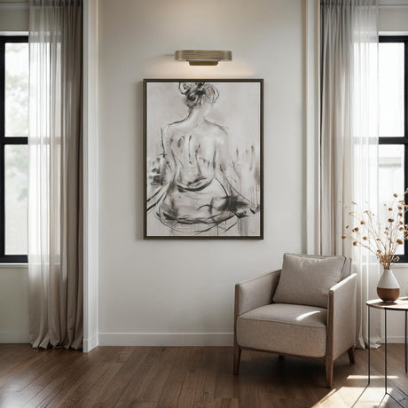 Renwil Priya picture light installed above framed artwork in a living room