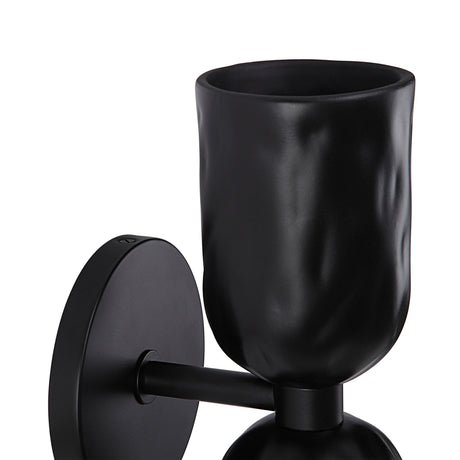 Close-up of the Renwil Alessia textured shade and sconce arm
