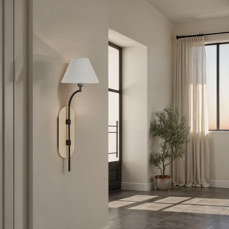 Renwil Acca wall sconce installed in a modern hallway beside a doorway