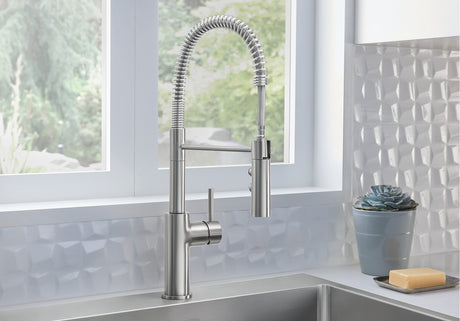 Blanco Catris Semi-Pro Faucet installed in a bright, modern kitchen—PVD Steel finish