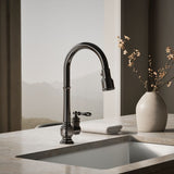 Artifacts® Pull-down kitchen sink faucet with three-function sprayhead