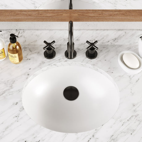 Icera Malibu 15-inch undermount bathroom sink in Gloss White, installed under a counter in a modern bathroom