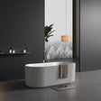 Modern bathroom with a freestanding bathtub, towel, and decorative elements.