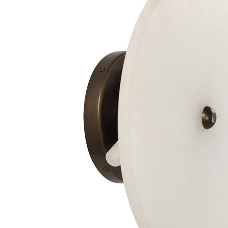 Close-up of the Lorenzo wall sconce alabaster disc and mounting base