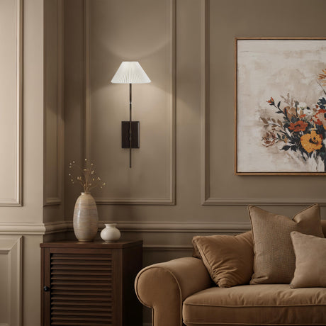 Margarita wall sconce installed beside a sofa in a transitional living room