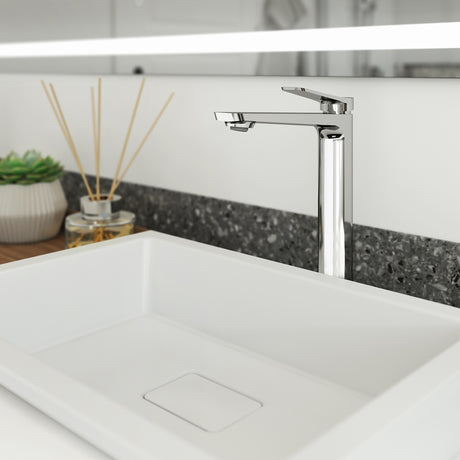 Kalia Moroka tall single hole bathroom sink faucet in Chrome installed on a vessel sink in a modern bathroom