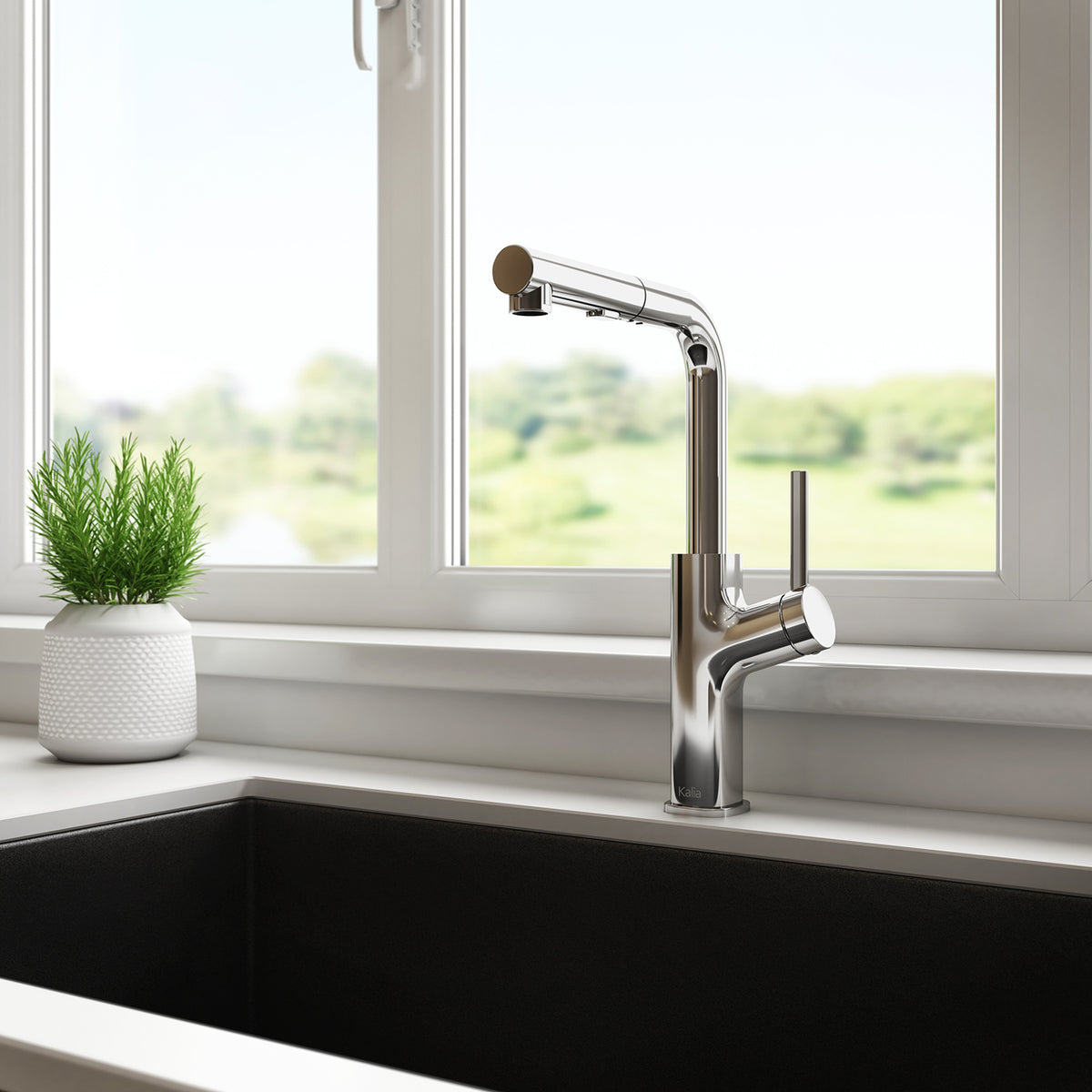 Kalia MASIMO surfer pull-out kitchen faucet installed at a sink by a window