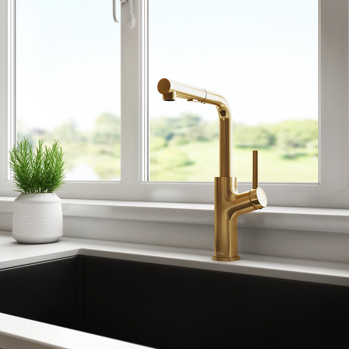 Kalia MASIMO surfer pull-out kitchen faucet in Brushed Gold installed at a kitchen sink
