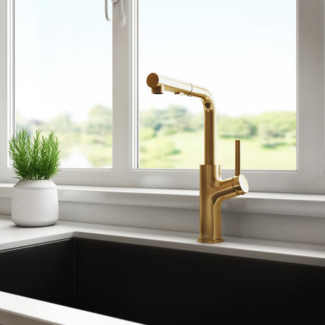 Kalia MASIMO surfer pull-out kitchen faucet in Brushed Gold installed at a kitchen sink