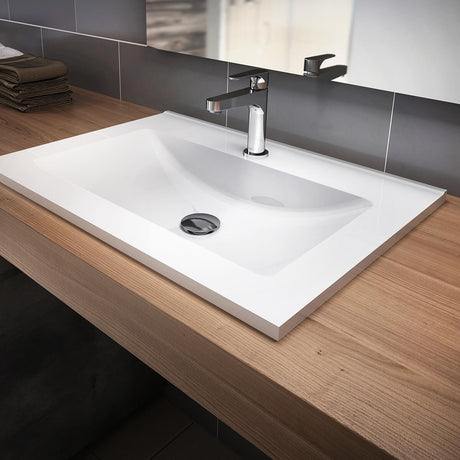 Kalia Kalm White Castylat countertop bathroom sink with single-hole faucet installed in a modern bathroom