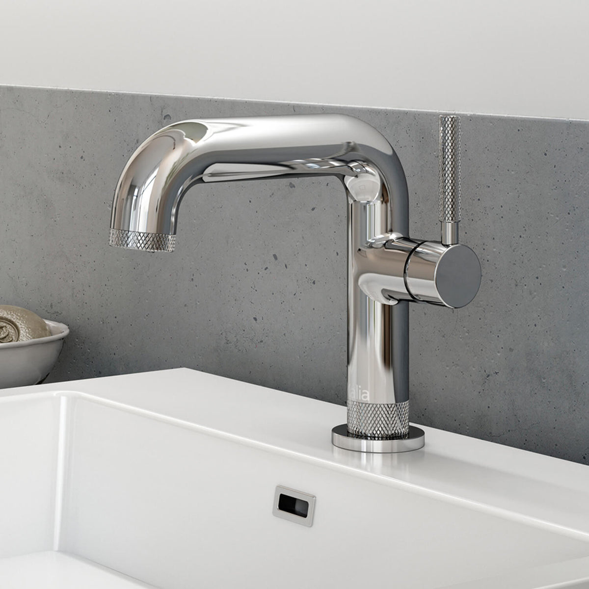 Kalia Preciso single hole bathroom sink faucet in Chrome with knurled lever handle, installed on a bathroom sink