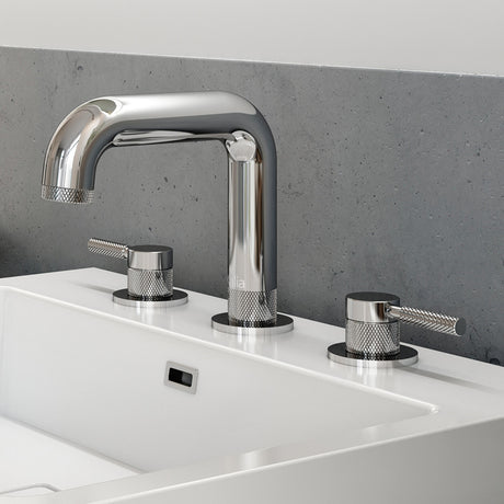 Kalia Preciso widespread bathroom sink faucet in Chrome with knurled lever handles, installed on a sink in a modern bathroom