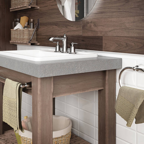 Kalia Rustik widespread bathroom sink faucet in Chrome with two lever handles, installed in a rustic bathroom